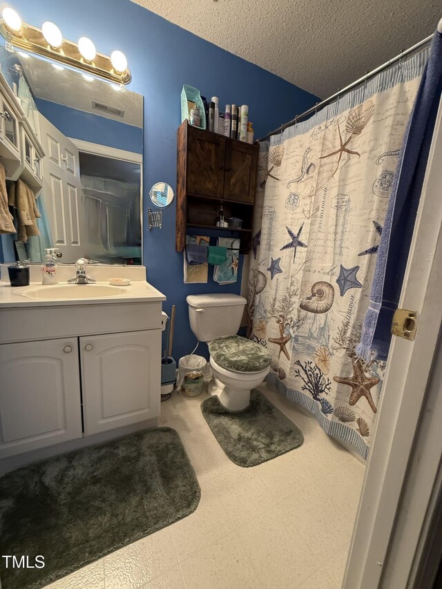1454-17 Cimarron Pkwy, Wake Forest, NC 27587 - full bathroom with a textured ceiling, visible vents, vanity, tile patterned floors, and toilet