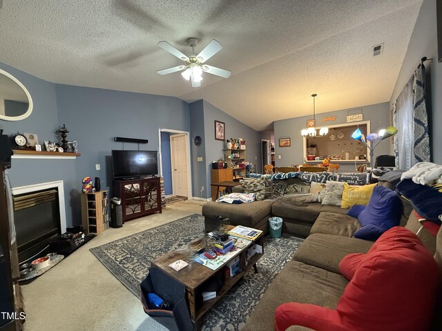 1454-17 Cimarron Pkwy, Wake Forest, NC 27587 - carpeted living area featuring visible vents, a fireplace with flush hearth, lofted ceiling, a textured ceiling, and a ceiling fan