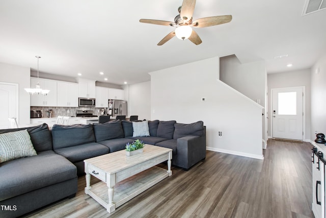 living room with ceiling fan, recessed lighting, baseboards, wood finished floors, and visible vents