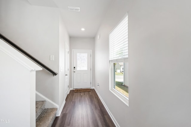 entryway featuring stairs, recessed lighting, baseboards, dark wood-type flooring, and visible vents