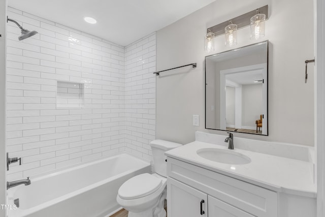 full bath with vanity, shower / bath combination, and toilet