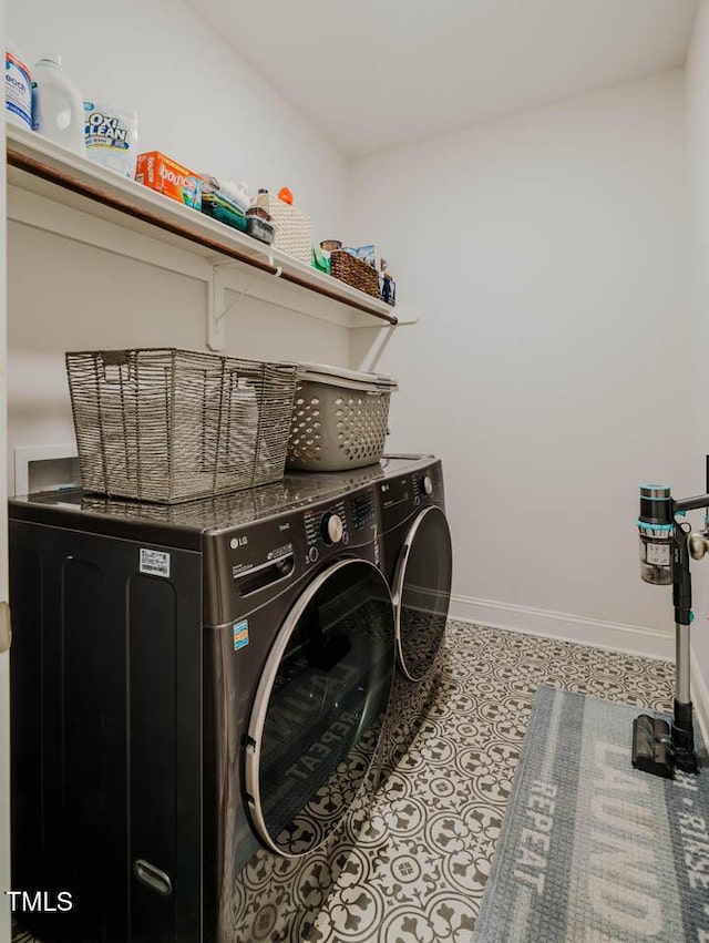4072 Mackenzie Dr, Haw River, NC 27258 - washroom with washer and clothes dryer and baseboards