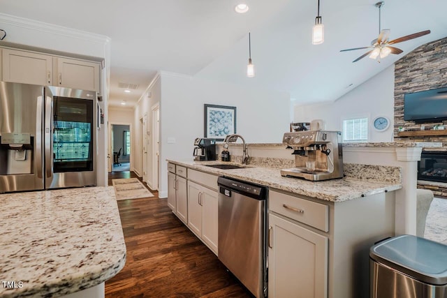 4072 Mackenzie Dr, Haw River, NC 27258 - kitchen with appliances with stainless steel finishes, a sink, ceiling fan, dark wood-style floors, and an island with sink
