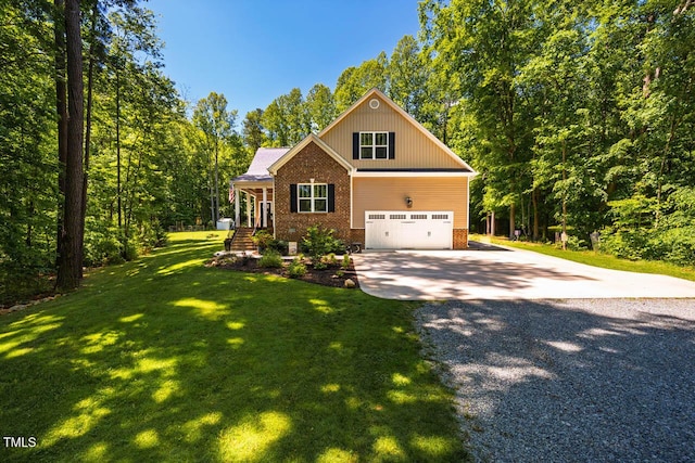 4072 Mackenzie Dr, Haw River, NC 27258 - craftsman inspired home featuring gravel driveway, brick siding, a front yard, and an attached garage