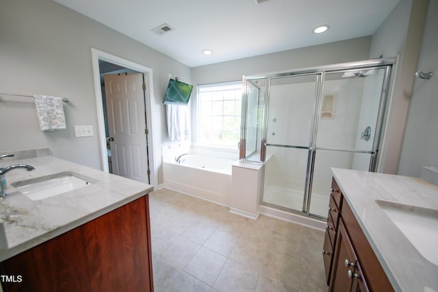 full bath with vanity, a bath, a stall shower, and visible vents