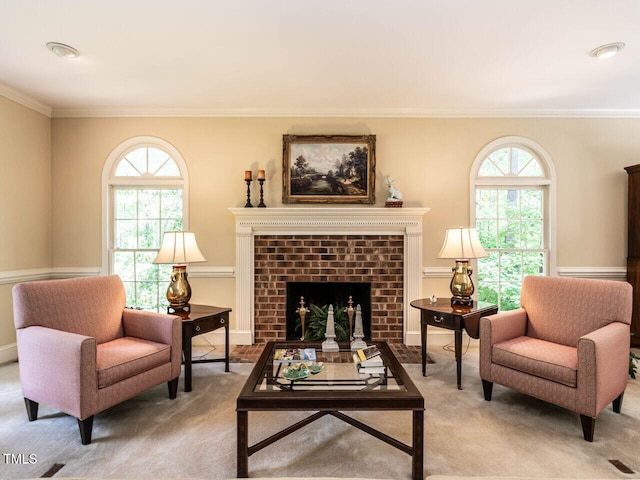 living area with carpet floors, ornamental molding, and a wealth of natural light