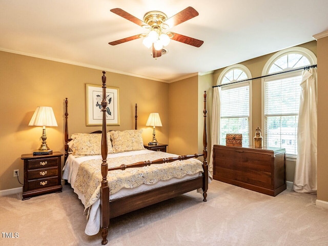 bedroom with baseboards, ornamental molding, a ceiling fan, and carpet flooring
