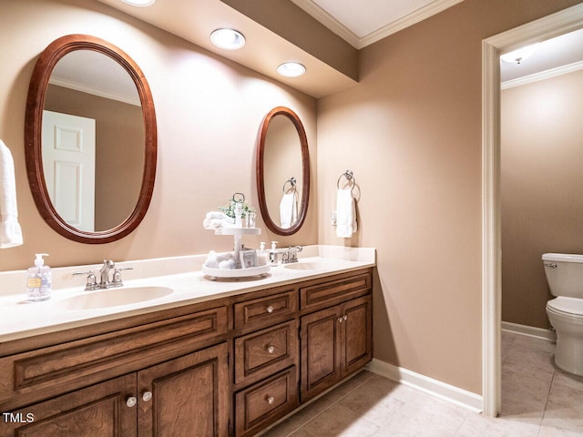 bathroom with double vanity, ornamental molding, toilet, tile patterned floors, and a sink