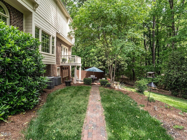 view of yard with central AC