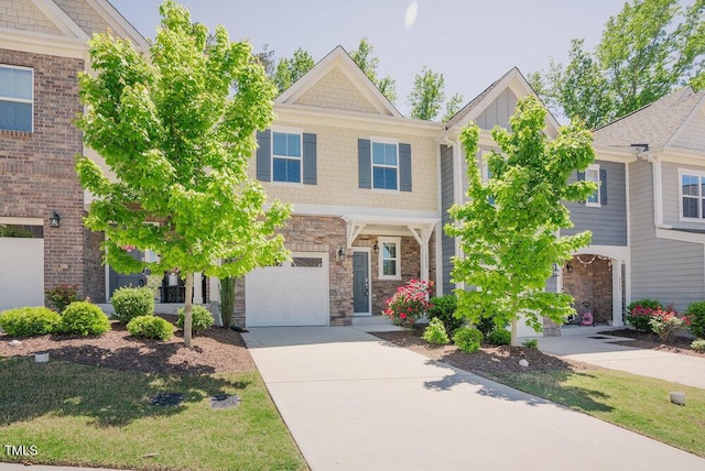 view of front of home featuring a garage, driveway, and stone siding