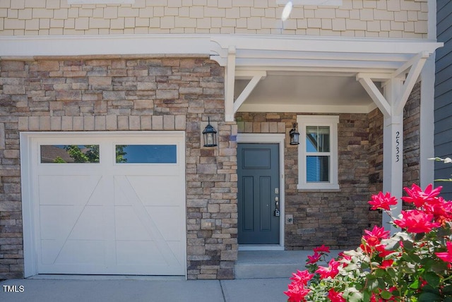 view of exterior entry featuring stone siding