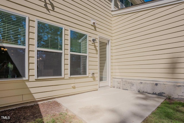entrance to property with a patio