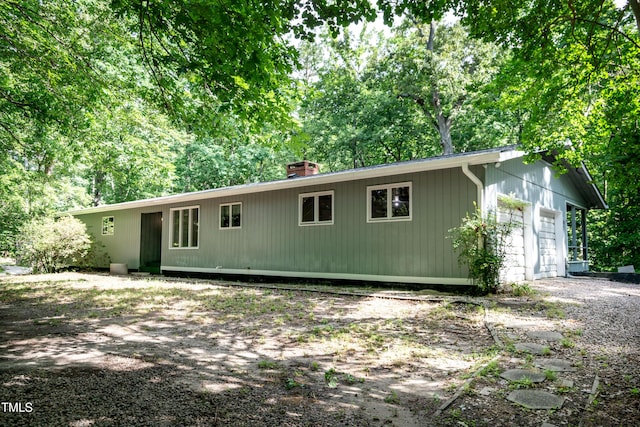 5213 Tomahawk Trl, Raleigh, NC 27610 - ranch-style home with a chimney