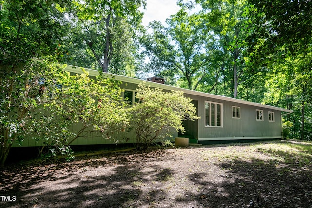 5213 Tomahawk Trl, Raleigh, NC 27610 - view of front facade with a chimney