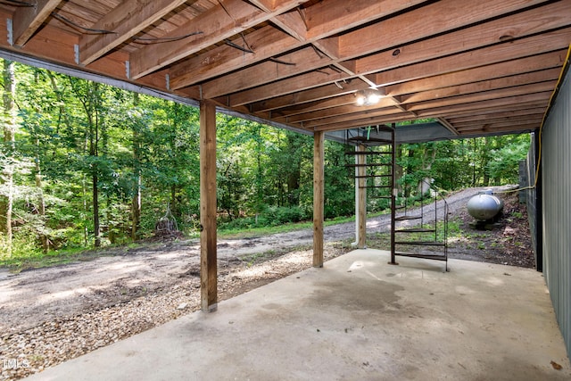 5213 Tomahawk Trl, Raleigh, NC 27610 - view of patio / terrace with a view of trees and heating fuel