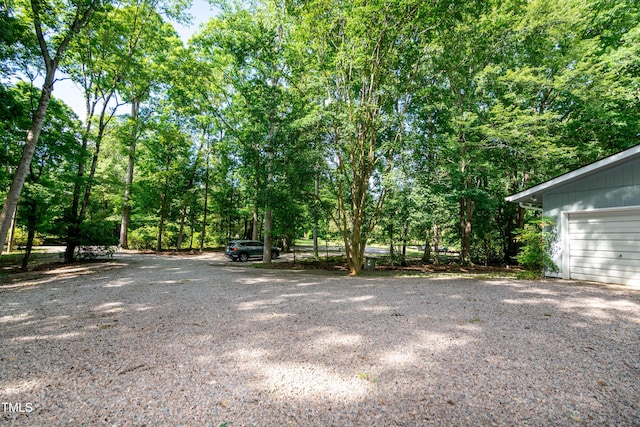 5213 Tomahawk Trl, Raleigh, NC 27610 - view of yard with a garage