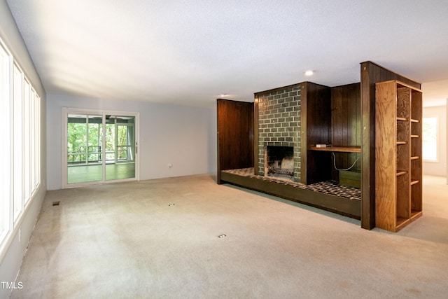 5213 Tomahawk Trl, Raleigh, NC 27610 - unfurnished living room with carpet, plenty of natural light, a fireplace, and recessed lighting