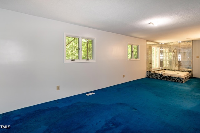 5213 Tomahawk Trl, Raleigh, NC 27610 - unfurnished living room with carpet floors and a textured ceiling
