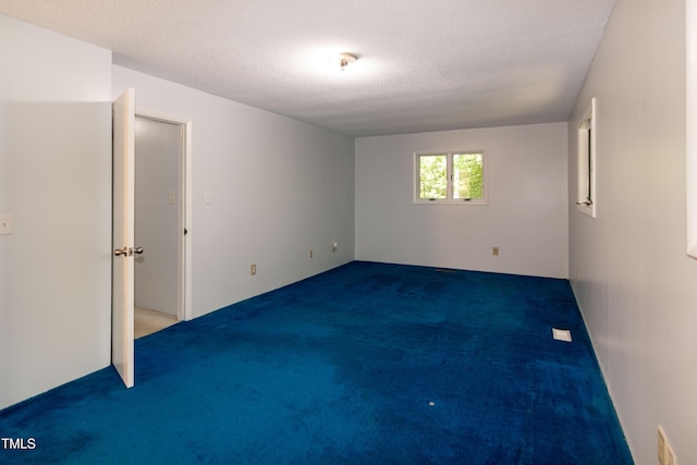 5213 Tomahawk Trl, Raleigh, NC 27610 - carpeted empty room featuring a textured ceiling