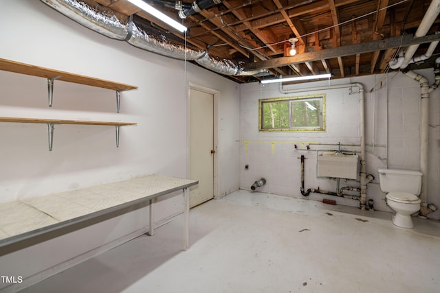5213 Tomahawk Trl, Raleigh, NC 27610 - basement with a sink and concrete block wall