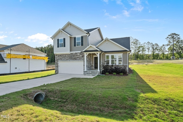craftsman inspired home with concrete driveway, stone siding, a front lawn, and a garage