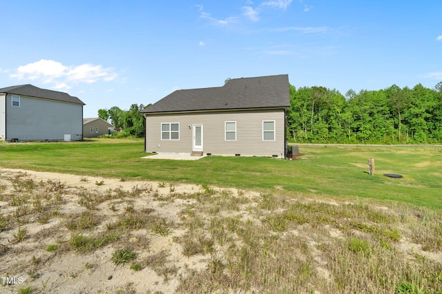 rear view of house with a yard, central air condition unit, a patio, and crawl space