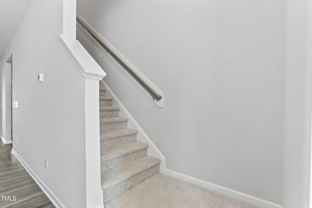 stairs featuring baseboards