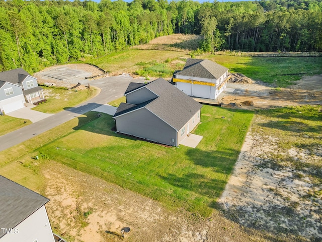 aerial view with a wooded view
