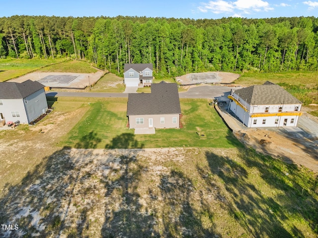 drone / aerial view with a view of trees