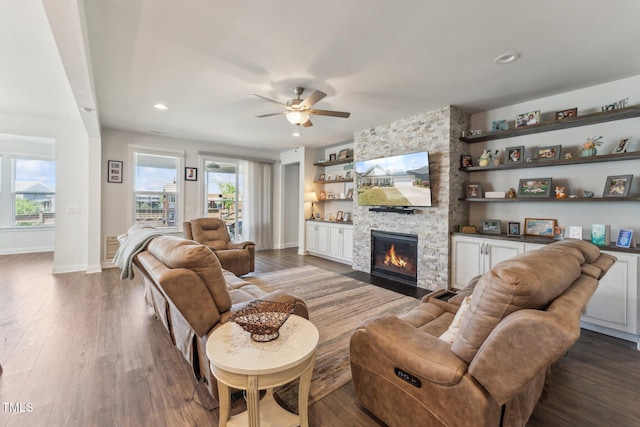 104 Lingonberry Dr, Holly Springs, NC 27540 - living room with ceiling fan, dark wood-style floors, baseboards, and a fireplace