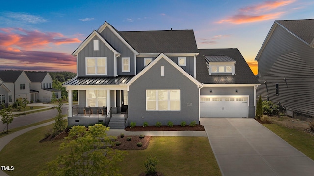 236 Artisan Park Dr, Wake Forest, NC 27587 - view of front of home with covered porch, concrete driveway, a garage, board and batten siding, and a yard