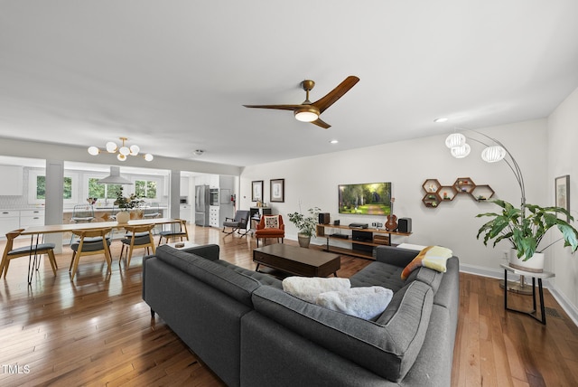 living area featuring a ceiling fan, recessed lighting, and hardwood / wood-style floors
