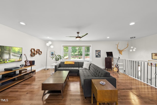 living area with wood-type flooring, recessed lighting, and ceiling fan