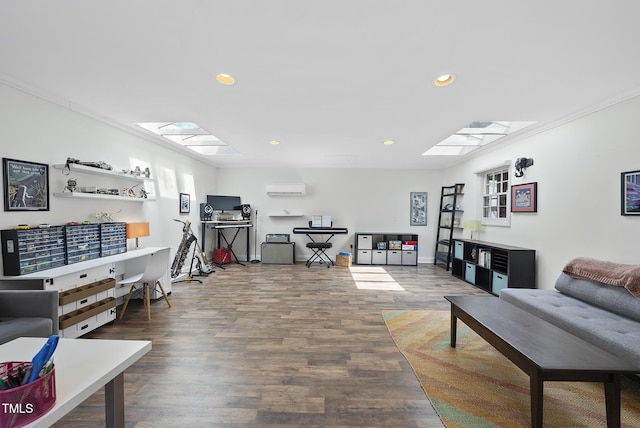 living area with a skylight, recessed lighting, and wood finished floors