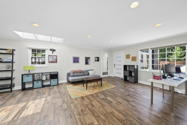 living room with baseboards, recessed lighting, a skylight, and wood finished floors