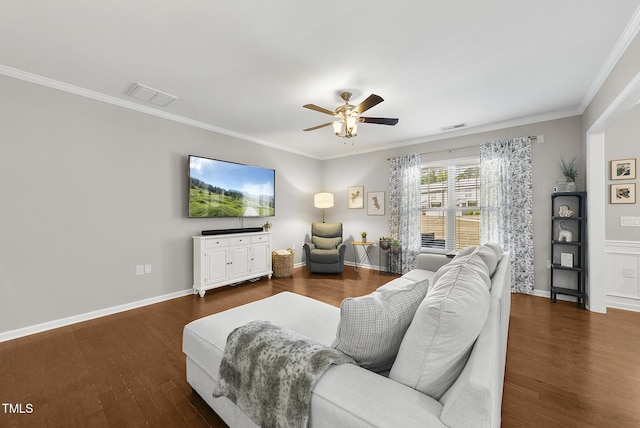 living room featuring visible vents, ornamental molding, ceiling fan, and dark wood-style floors