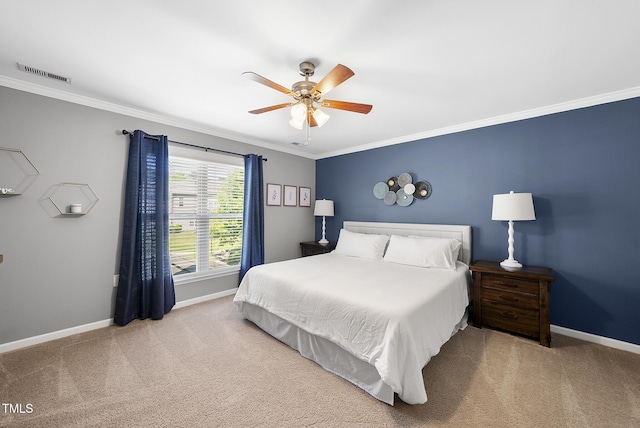 bedroom with visible vents, ornamental molding, baseboards, and carpet