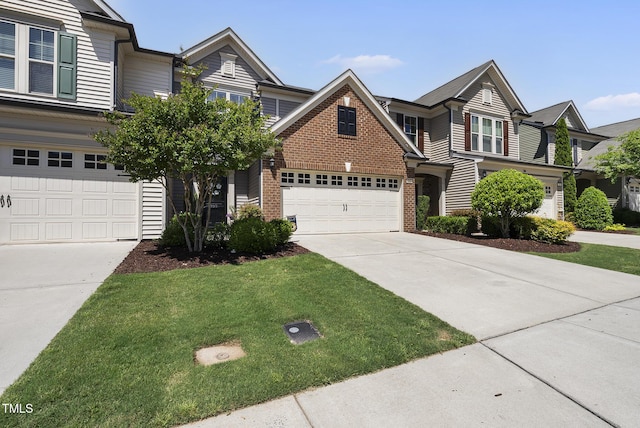 view of front of house with concrete driveway, a front lawn, and brick siding