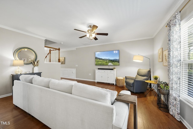 living room featuring crown molding, dark wood-style flooring, and ceiling fan