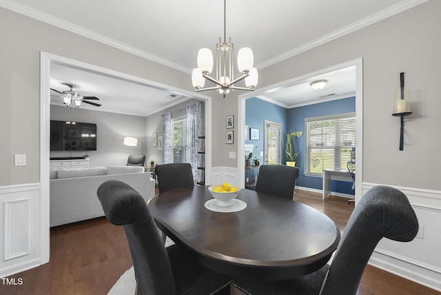 dining area with plenty of natural light, ornamental molding, and dark wood-style floors