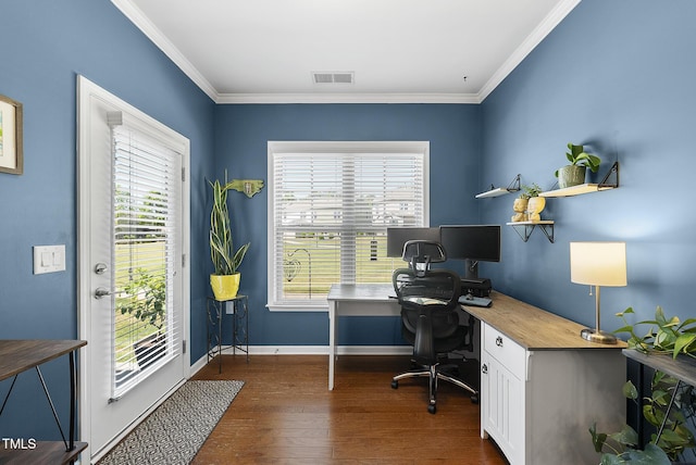 office featuring visible vents, ornamental molding, dark wood-style flooring, and a healthy amount of sunlight