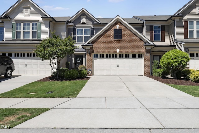 view of front of house with concrete driveway and brick siding