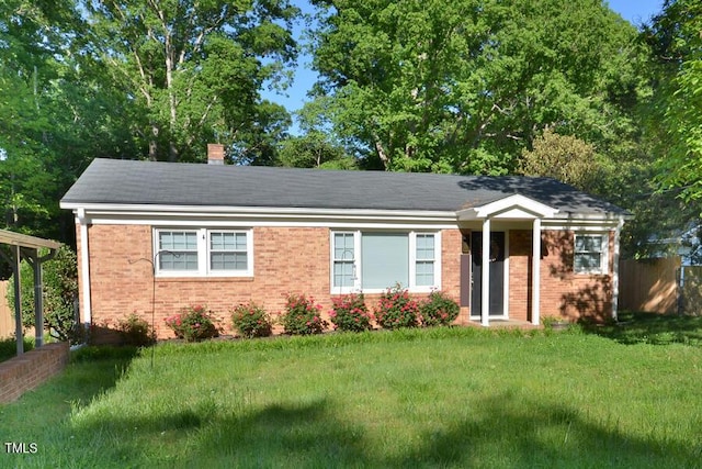 114 Short St E, Hillsborough, NC 27278 - single story home with brick siding, fence, a chimney, and a front yard