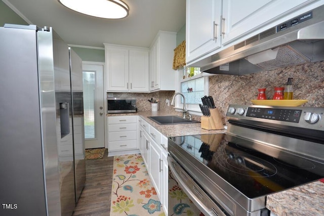 114 Short St E, Hillsborough, NC 27278 - kitchen featuring white cabinets, a sink, stainless steel appliances, decorative backsplash, and under cabinet range hood
