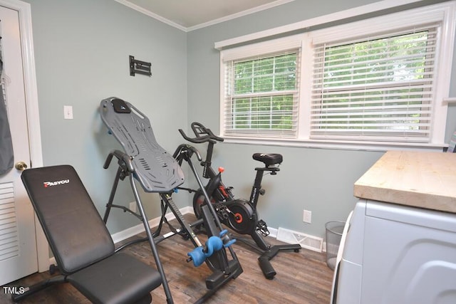 114 Short St E, Hillsborough, NC 27278 - exercise room featuring visible vents, crown molding, wood finished floors, baseboards, and washer / dryer