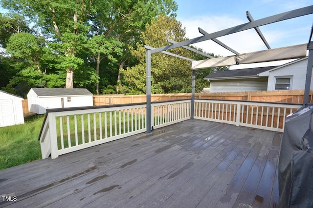 114 Short St E, Hillsborough, NC 27278 - deck featuring an outdoor structure, a fenced backyard, a shed, and a pergola