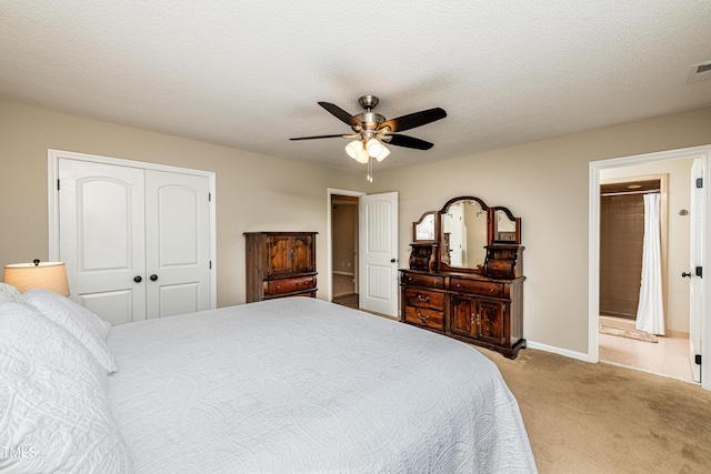 bedroom with a ceiling fan, visible vents, baseboards, a closet, and carpet