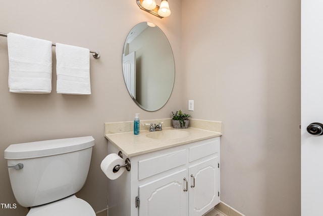 half bath with toilet and vanity