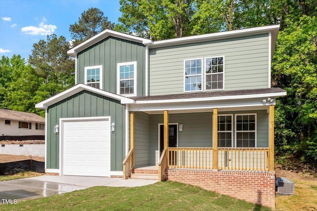 traditional home with central air condition unit, board and batten siding, a porch, and a front lawn