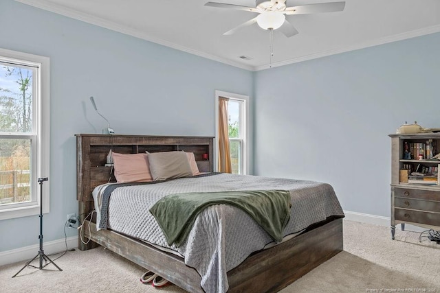 carpeted bedroom featuring baseboards, visible vents, and multiple windows